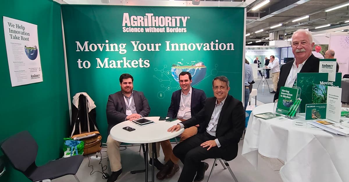 AgriThority® team sitting at their booth at the Annual Biocontrol Industry Meeting